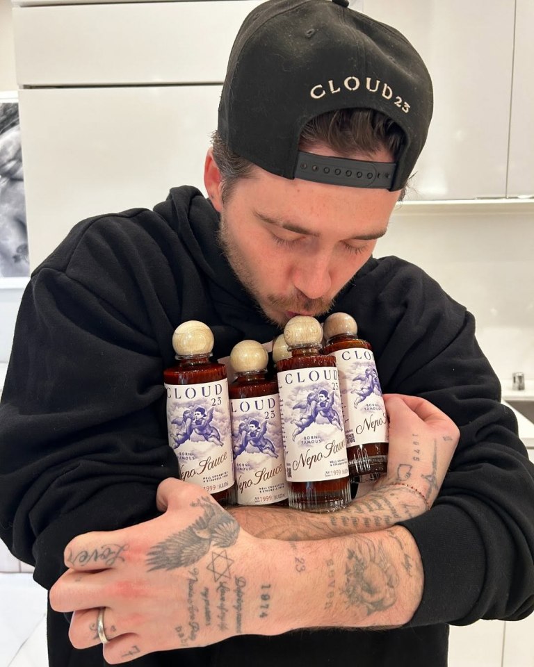 Brooklyn Beckham hugging bottles of Cloud 23 Nepo Sauce.