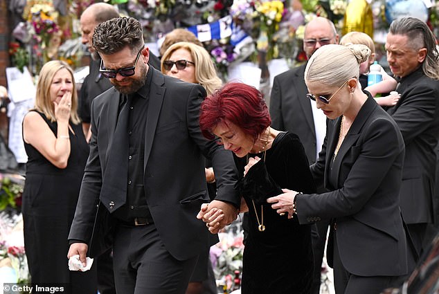 Ozzy's widow Sharon, 72, was supported by their children Jack, Kelly and Aimee who laid floral tributes and made a peace sign as they gestured their gratitude to fans