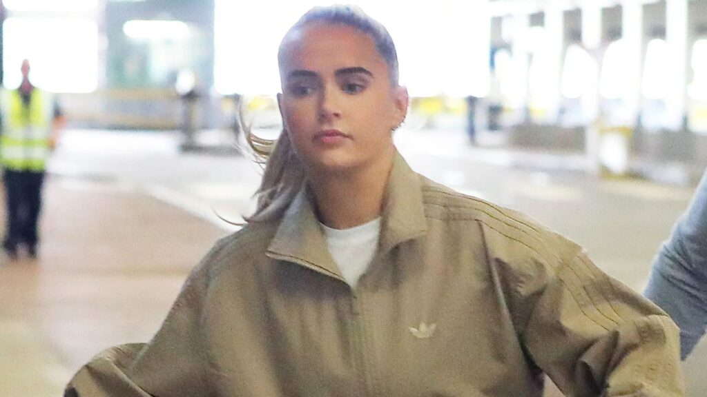 Molly Mae can't raise a smile as she jets off on holiday with Tommy after moaning 'not doing one fun thing' in summer