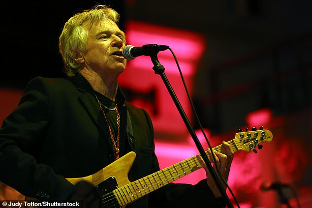 70s rock legend Dave Edmunds is fighting for his life in hospital after suffering a major cardiac arrest, his wife has revealed (pictured in 2014)