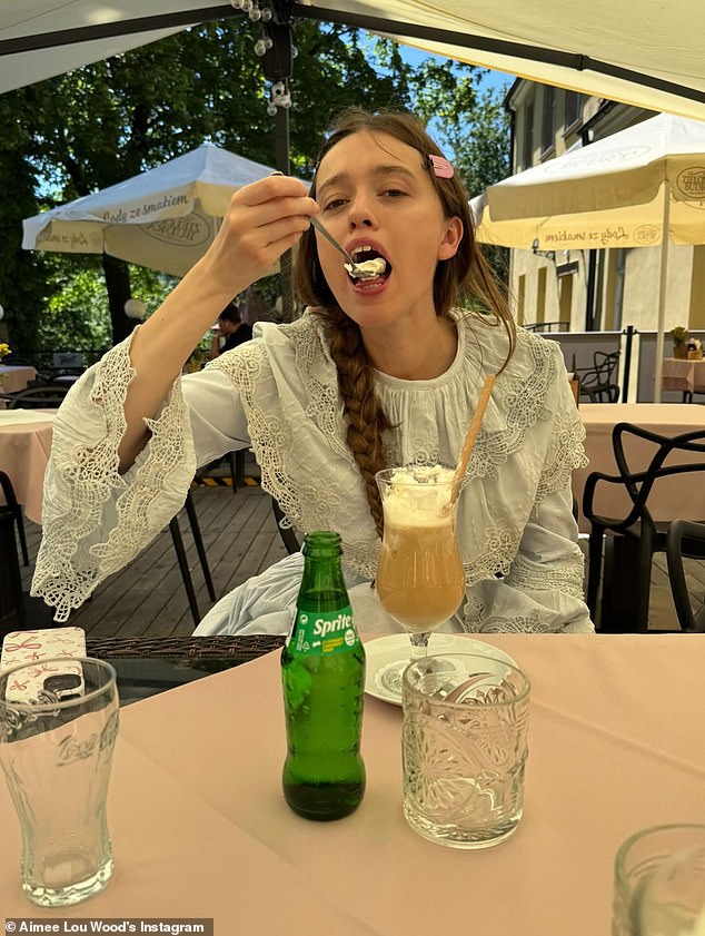 She could be seen enjoying a coffee in the period outfit, with her hair styled in a long side plait