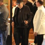 Al Pacino grinned ear to ear when he got a kiss from a young woman in Rome on Monday. The 85-year-old cinema icon was spotted dropping by the restaurant Il Bolognese in Piazza del Popolo for dinner while in Italy to film the biopic Maserati: The Brothers