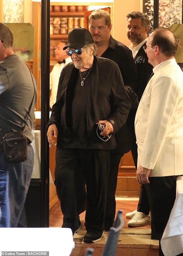 Al Pacino grinned ear to ear when he got a kiss from a young woman in Rome on Monday. The 85-year-old cinema icon was spotted dropping by the restaurant Il Bolognese in Piazza del Popolo for dinner while in Italy to film the biopic Maserati: The Brothers