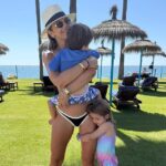 Vogue Williams looked every inch the doting mother as she shared sweet family holiday pictures to Instagram on Sunday (pictured with Otto and Gigi)