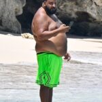 DJ Khaled came close to showing off more of his figure than he intended to when he was seen enjoying a beach day in Barbados