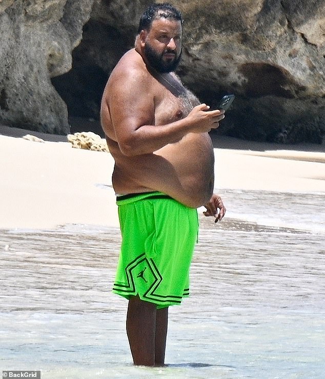 DJ Khaled came close to showing off more of his figure than he intended to when he was seen enjoying a beach day in Barbados