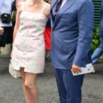 Michael McIntyre cosied up to leggy wife Kitty as they attended day eight of Wimbledon at The All England Lawn Tennis Club on Monday