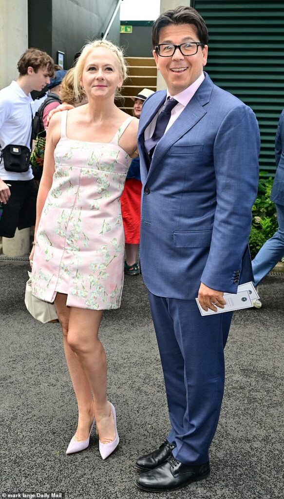 Michael McIntyre cosied up to leggy wife Kitty as they attended day eight of Wimbledon at The All England Lawn Tennis Club on Monday