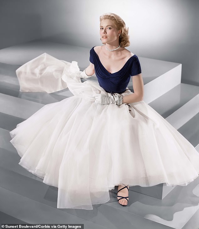 The original design — a romantic navy dress with a dramatic portrait neckline and voluminous white skirt — was the work of legendary Hollywood costume designer Edith Head