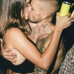 Hailey Bieber, 28, was pictured giving a shirtless Justin Bieber, 31, a passionate kiss on Friday, as she shrugged off his recent album revelations about their marriage woes