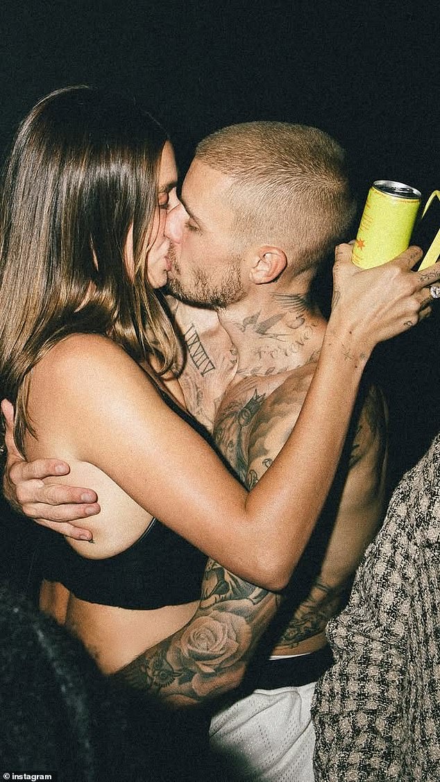 Hailey Bieber, 28, was pictured giving a shirtless Justin Bieber, 31, a passionate kiss on Friday, as she shrugged off his recent album revelations about their marriage woes