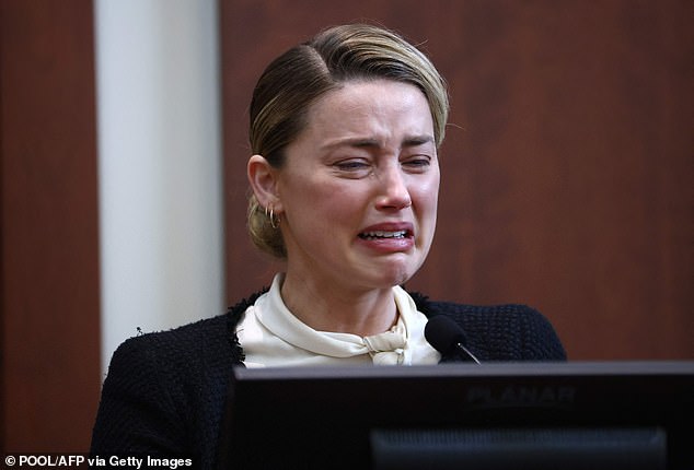 Today, in the final part of our gripping series, we chart the bitter unravelling of their marriage – and how Amber's transformation into a #MeToo icon would set the stage for one of the most explosive celebrity trials of the decade. Pictured: Amber testifies in court after Johnny sued her for libel in 2018