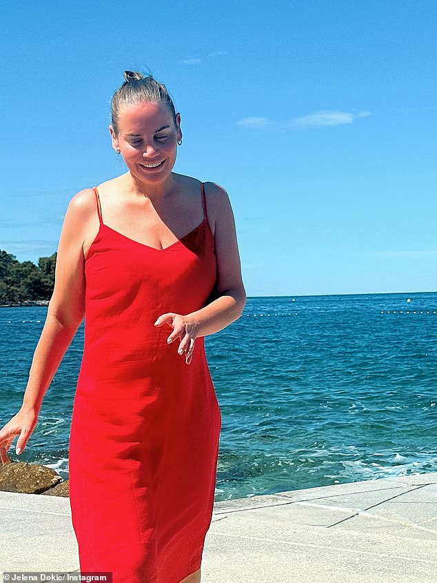 Jelena Dokic ensured all eyes were on her on Monday when she flaunted her slimmed-down frame in Croatia. In one image, Jelena was all smiles as she posed in a ruby red summer frock that featured strappy sleeves and a midi-length skirt. Pictured