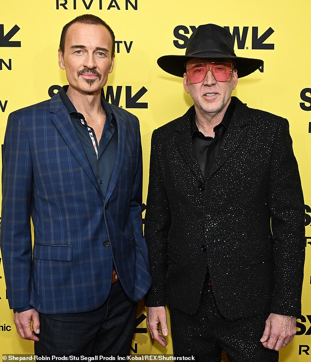 Julian's last public appearance was alongside Nicolas Cage at SXSW in Texas in March where he looked thin as he promoted The Surfer - he died from lung metastasis