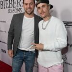 Justin Bieber has agreed to hand over millions to his ex-manager Scooter Braun as their years-long financial dispute comes to an end; seen in 2020