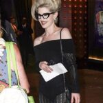 Kelly Osbourne showcased her slender frame in a knitted dress and sported a voluminous blonde beehive as she attended the Diamonds and Dust gala