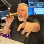 An irate Kyle Sandilands sensationally stormed off his radio show on Wednesday after being dumped from the airwaves