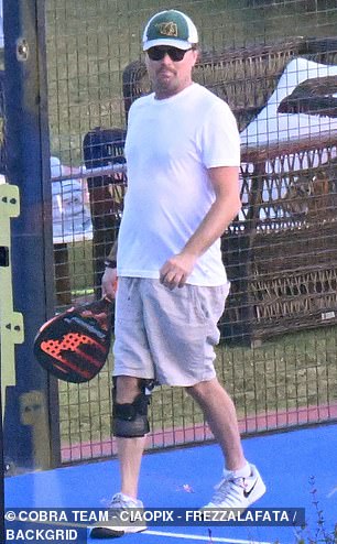 Leonardo DiCaprio, 50, sported a knee brace while enjoying a padel match with his model girlfriend Vittoria Ceretti during their lavish Italian getaway on Sunday