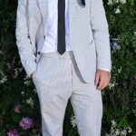 Will Poulter (pictured) appeared to be wearing wonky trousers and odd socks