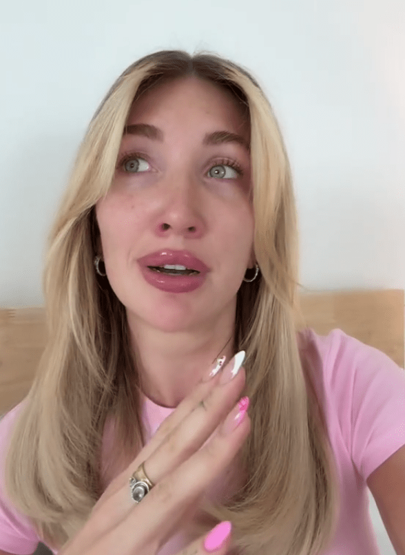 Screenshot of a blonde woman speaking.