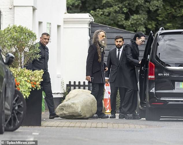 Marilyn Manson (right) attended the private service this afternoon, alongside Rob Zombie (centre)