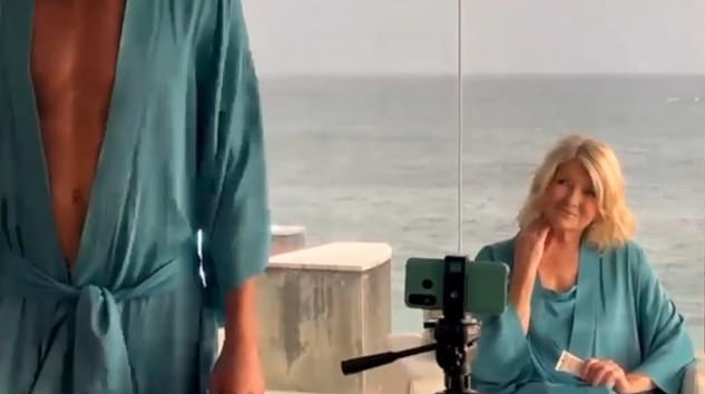 The 83-year-old,can be seen keeping company with a 'mystery man' in the clip in which the pair appeared to be dressed in matching satin bathrobes (pictured)