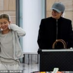 The Aussie TV presenter (right) was spotted at Sydney Airport on Tuesday with her rarely-seen daughter Maggie (left) who looks just like her