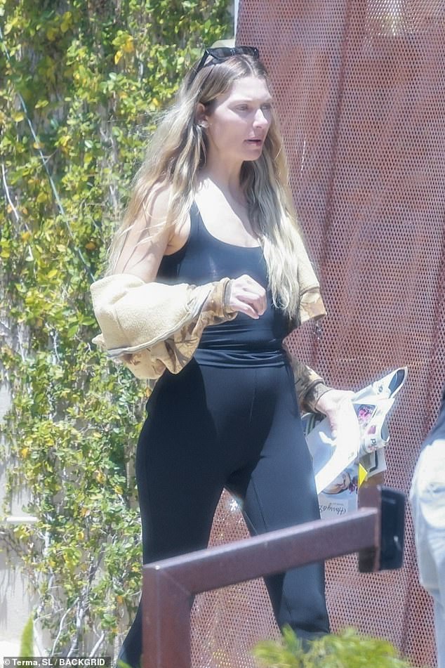 Jess Hart, 39, tried to go incognito in Los Angeles on Friday as she was spotted looking glum while moving some of her belongings into a storage facility