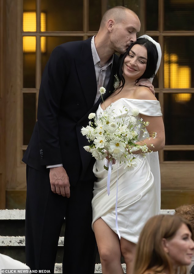 Charli XCX, 32,  has revealed emotional husband George Daniel, 35, cried during their intimate wedding at Hackney Town Hall on Saturday