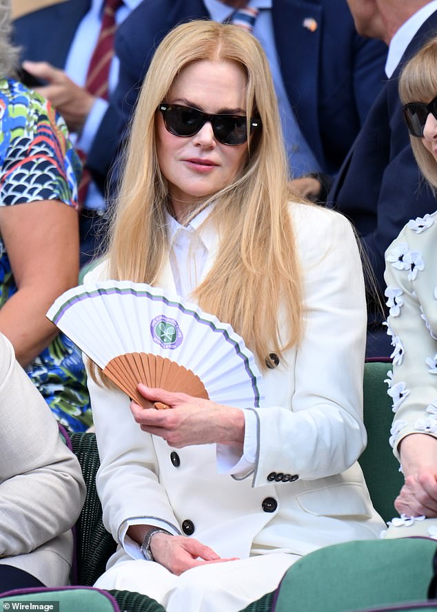 While she didn't entirely show off her natural curly tresses, Nicole opted for a straightened look to avoid any frizz in the heat