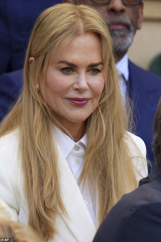 Nicole Kidman, 58, embraced her natural auburn locks at Wimbledon on Sunday after finally ditching wigs