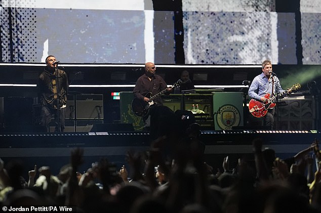 Liam and Noel Gallagher have finally arrived on stage at Cardiff's Principality Stadium for first night of the long-awaited Oasis reunion tour