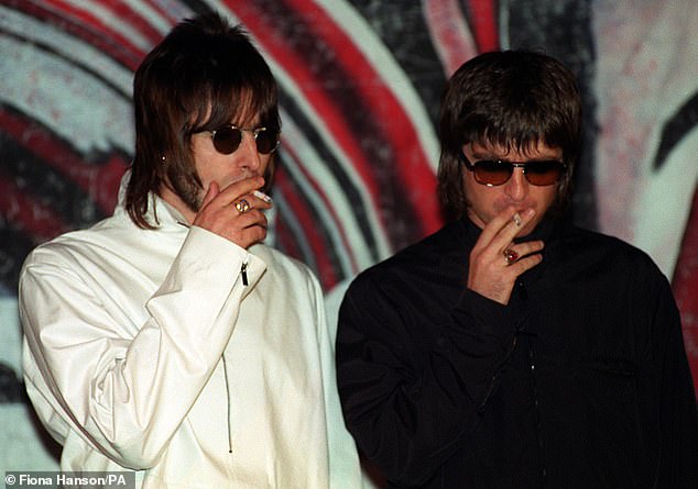 Now Oasis has gone woke, with the band's tell-all documentary is slapped with trigger warnings over 'smoking and drinking' (Liam and Noel Gallagher pictured in 1999)