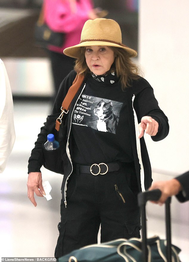 A horror movie icon who shot to fame in a 'cursed' blockbuster which threw her personal life into turmoil was seen on a rare public outing this week - who is she?