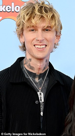 The 44-year-old DJ and reality TV star looked happy as can be as she posed with Megan Fox 's ex Machine Gun Kelly, 35. Seen in June