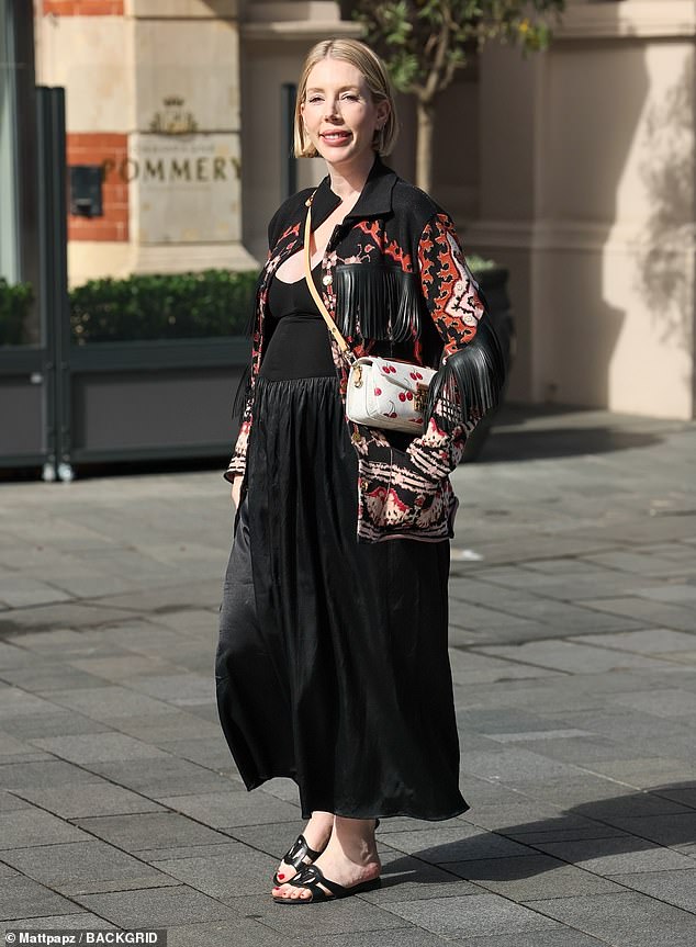 Katherine Ryan has admitted that she's feeling 'dejected' at the thought of her next baby being a boy [Pictured leaving Heart radio studios on Monday]