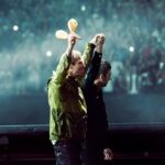 Liam and Noel Gallagher held hands as they walked out on the stage at Cardiff's Principality Stadium for night two of the Oasis tour on Saturday, before revealing the 'real reason' for their long-awaited reunion