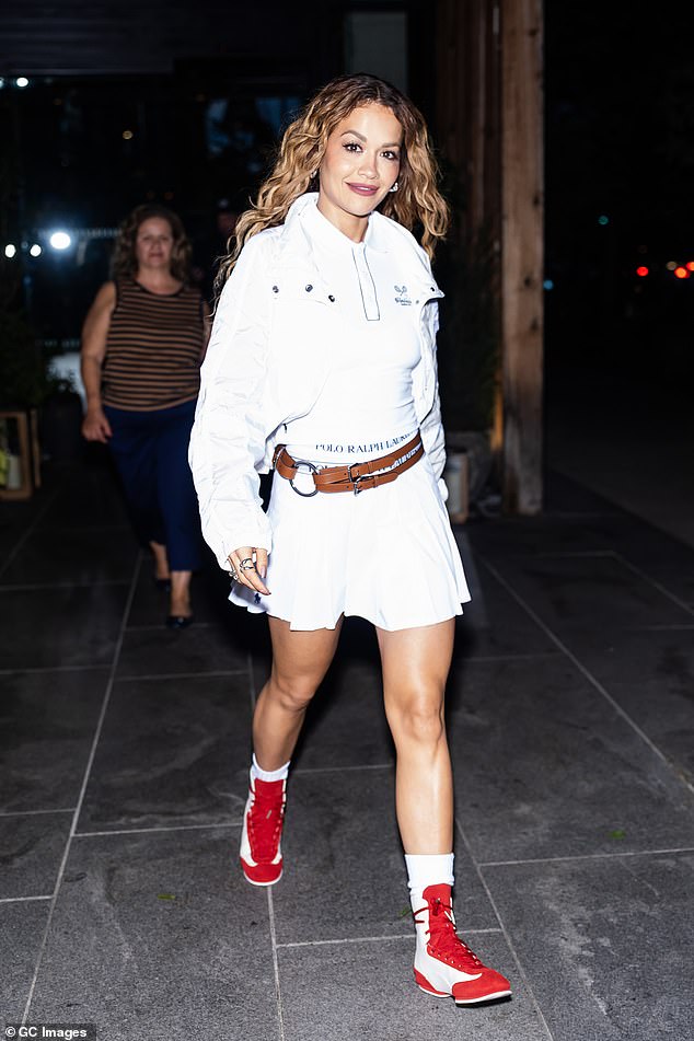 Rita Ora put on a stylish display in a Ralph Lauren white skater skirt as she was seen in Brooklyn on Friday ahead of her New York show