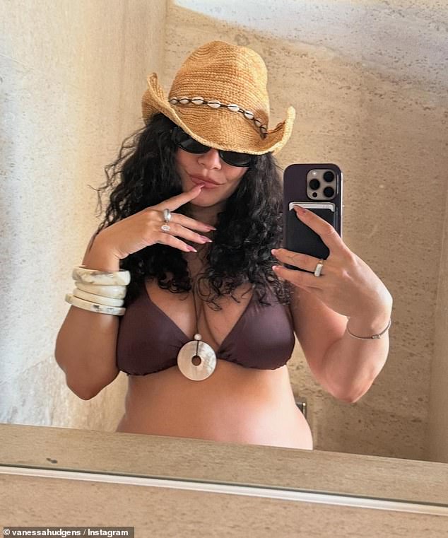 Vanessa Hudgens appeared online to share a glimpse of her growing baby bump on Friday