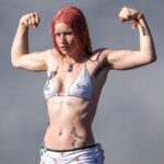 Rhian Teasdale of British indie-rock band Wet Leg showed off her toned abs and bulging biceps after taking to the stage at TRNSMT Festival on Friday