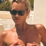 Supermodel legend Kate Moss, 51, stuns as she covers boobs while swimming topless on holiday in Ibiza