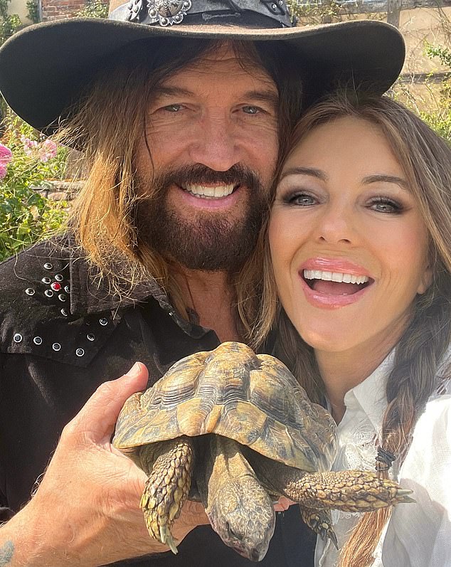 Billy Ray Cyrus is inspired these days. The country music singer is writing 'sexy' love songs about new girlfriend Elizabeth Hurley already, Daily Mail has learned