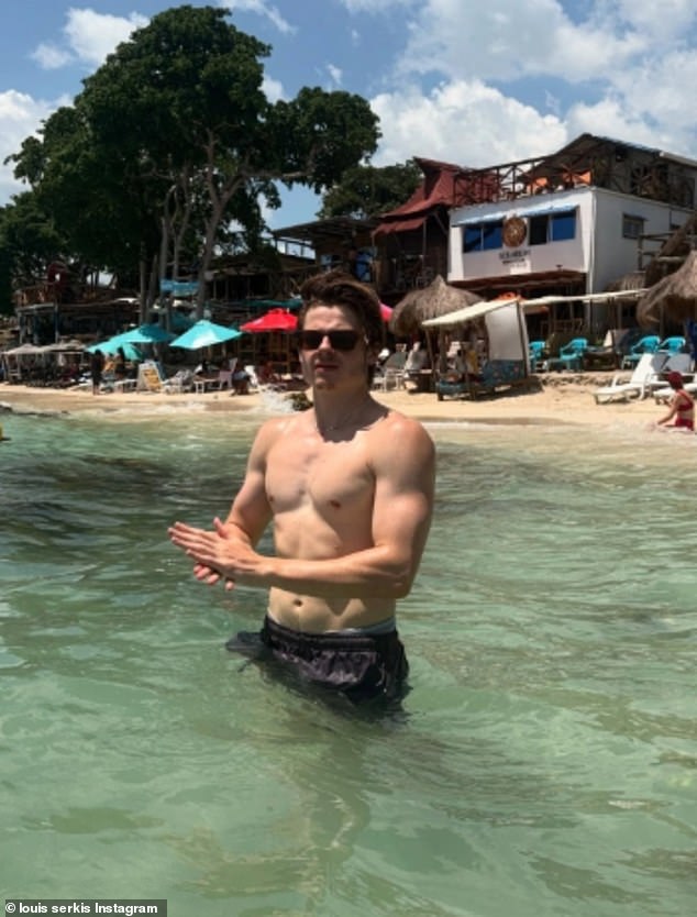 A Hollywood star's nepo baby son revealed his ripped torso and bulging biceps while on holiday with his stunning girlfriend on Instagram on Friday - but can you guess who is famous father is?